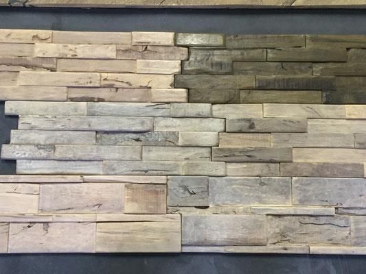 Auf einem Tisch steht eine Wand aus Holzklötzen.