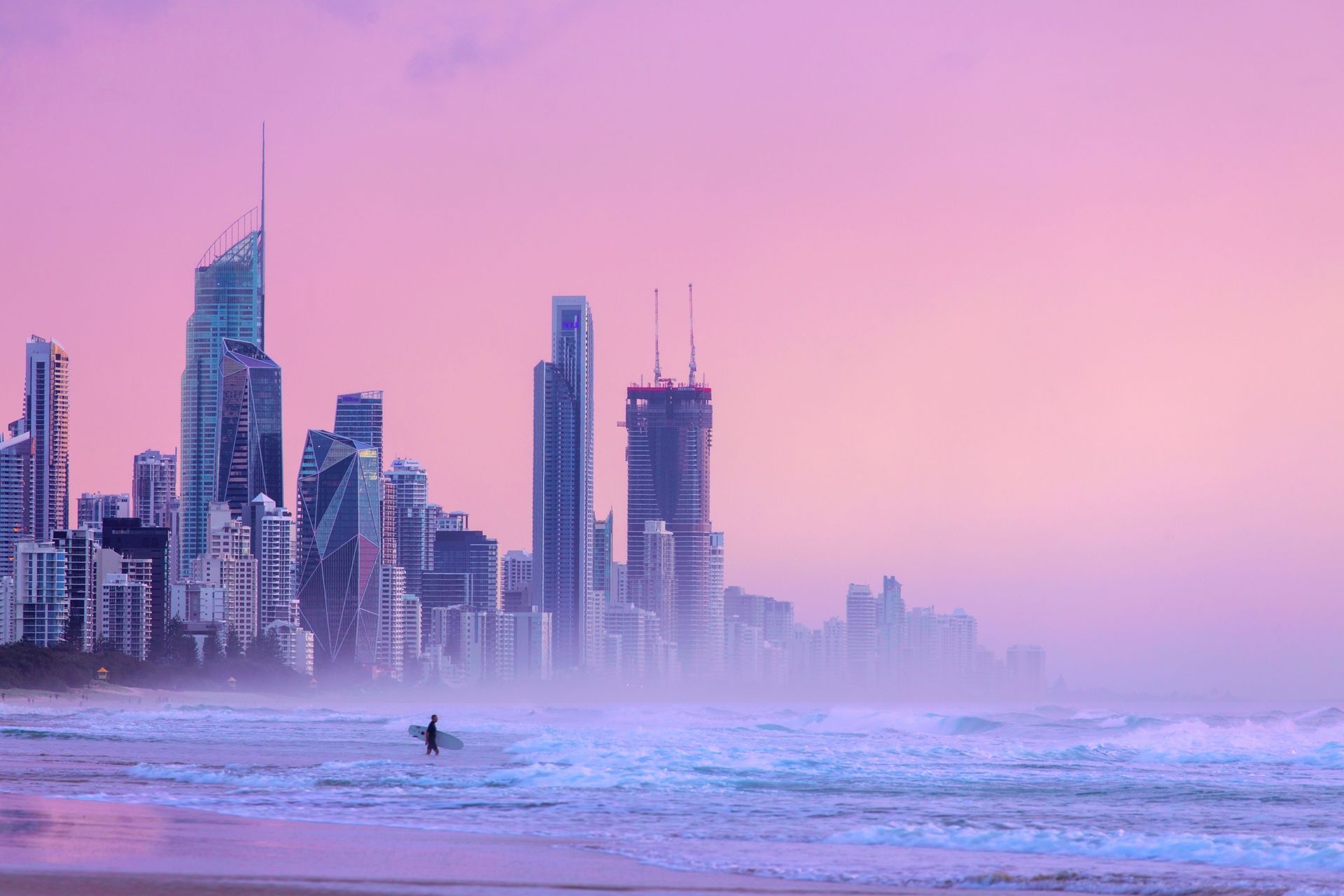 An beautiful view of a gold coast city with tall buildings and a beach.