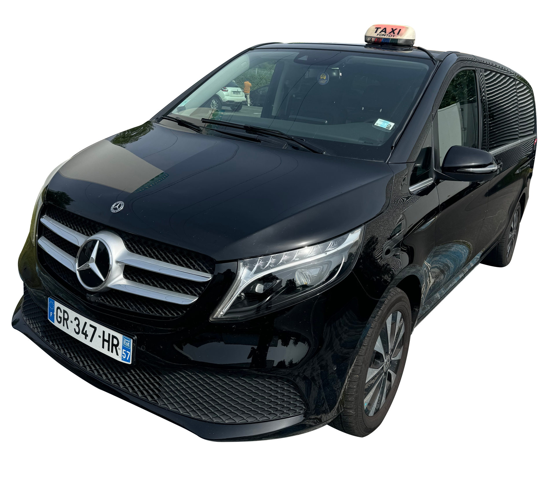 Camionnette taxi Mercedes noire avec panneau de taxi sur le toit et plaque d'immatriculation « ER-347-HR ».