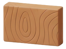 Bloc rectangulaire en bois beige orné de motifs ovales concentriques et de lignes courbes sculptés.