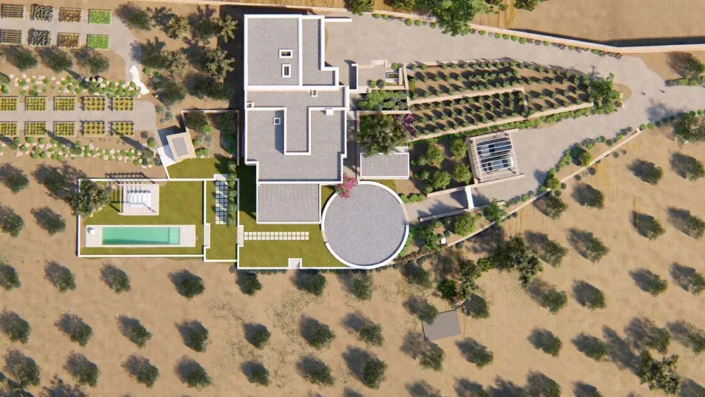 Una vista aérea de una casa con una piscina en el medio.