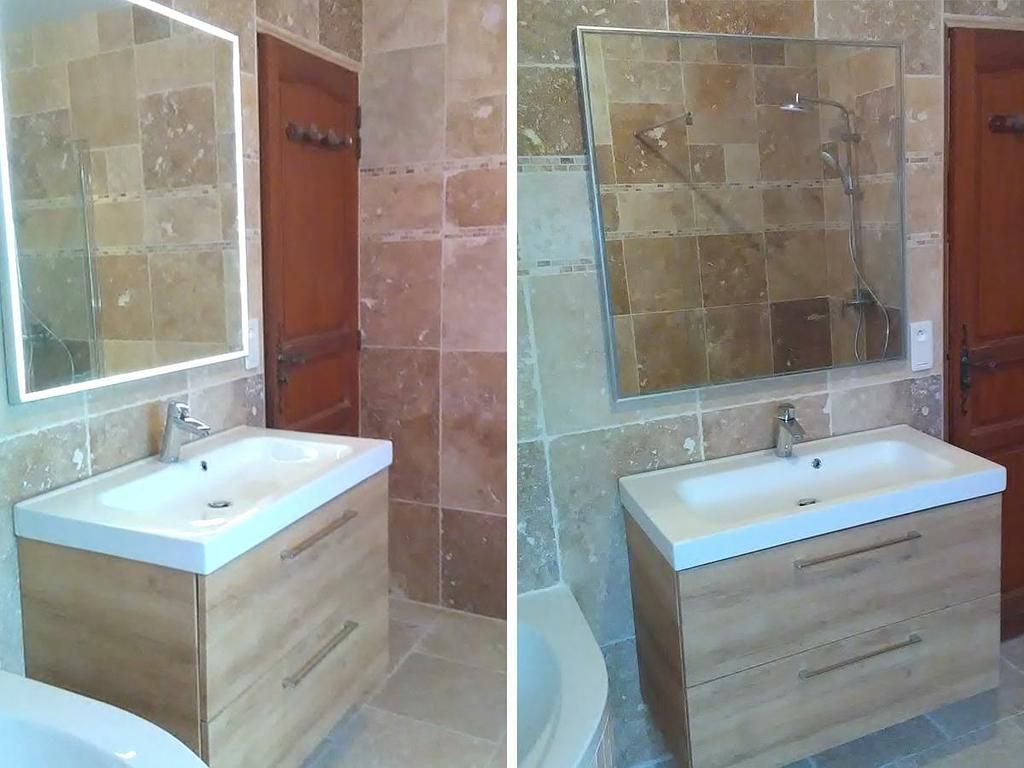 Salle de bain avec un évier et un grand miroir