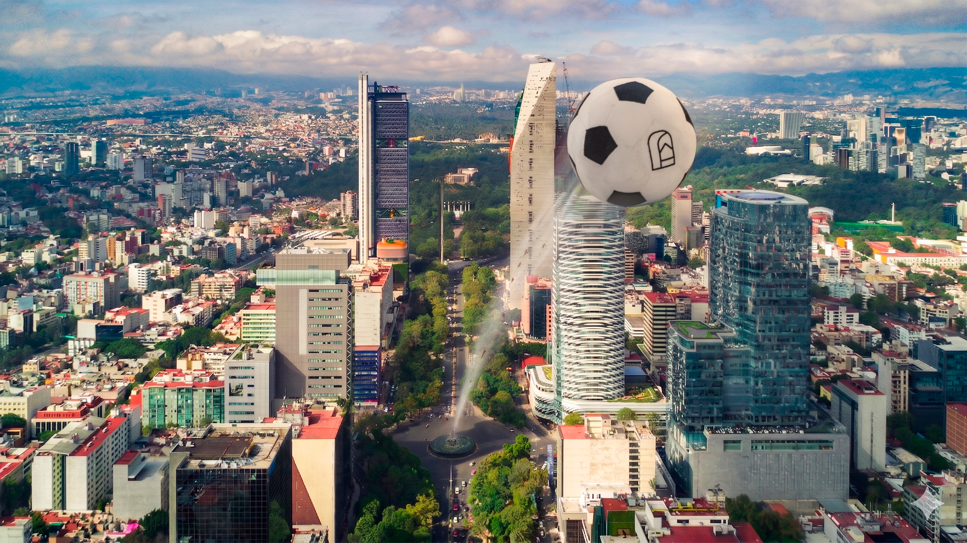 Aerial view of a city skyline with tall modern buildings and a giant floating soccer ball