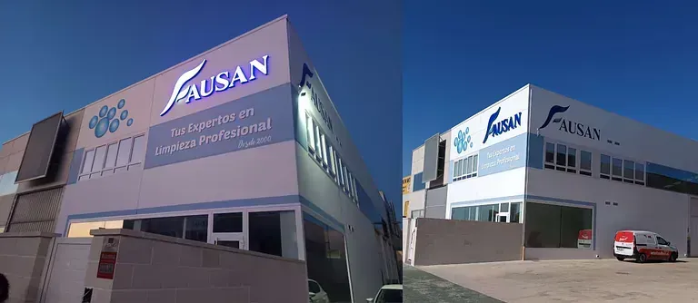 Fotografía en dos partes de la fachada de un edificio con el logotipo de FAUSAN iluminado. Hay una furgoneta estacionada a la derecha.