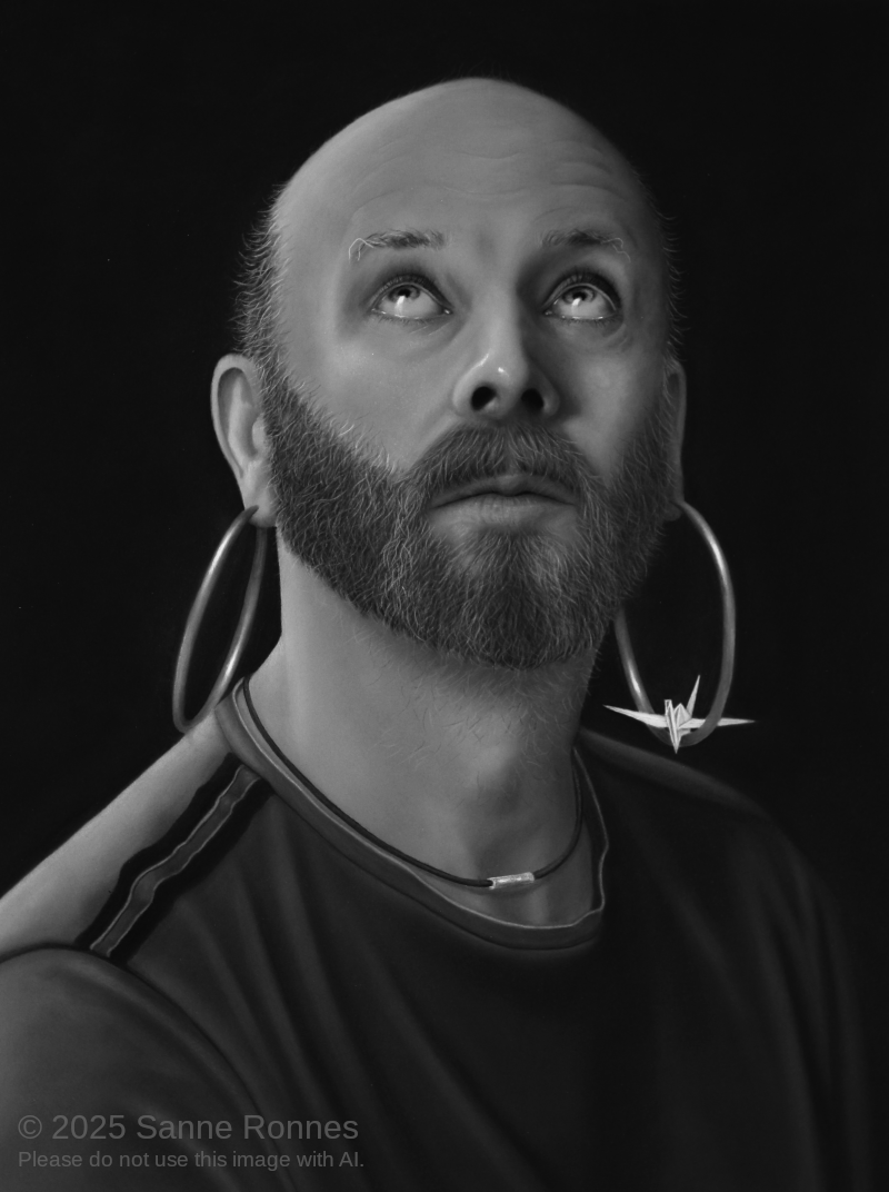 Bald man with beard and hoop earrings looks upwards; black and white charcoal drawing.