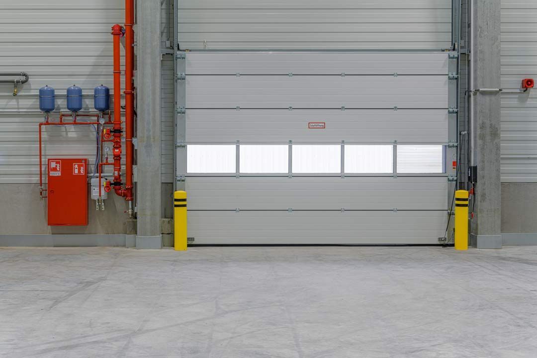 Porte automatique industrielle coupe-feu sectionnelle