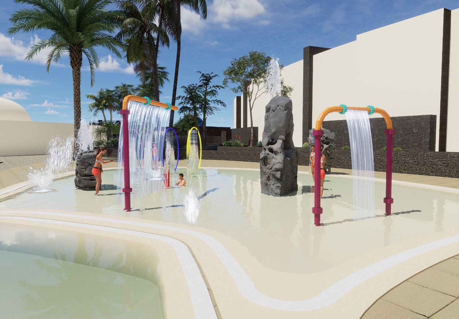 Un área de juegos acuáticos con fuentes, una palmera y varias personas jugando en una piscina de color claro.