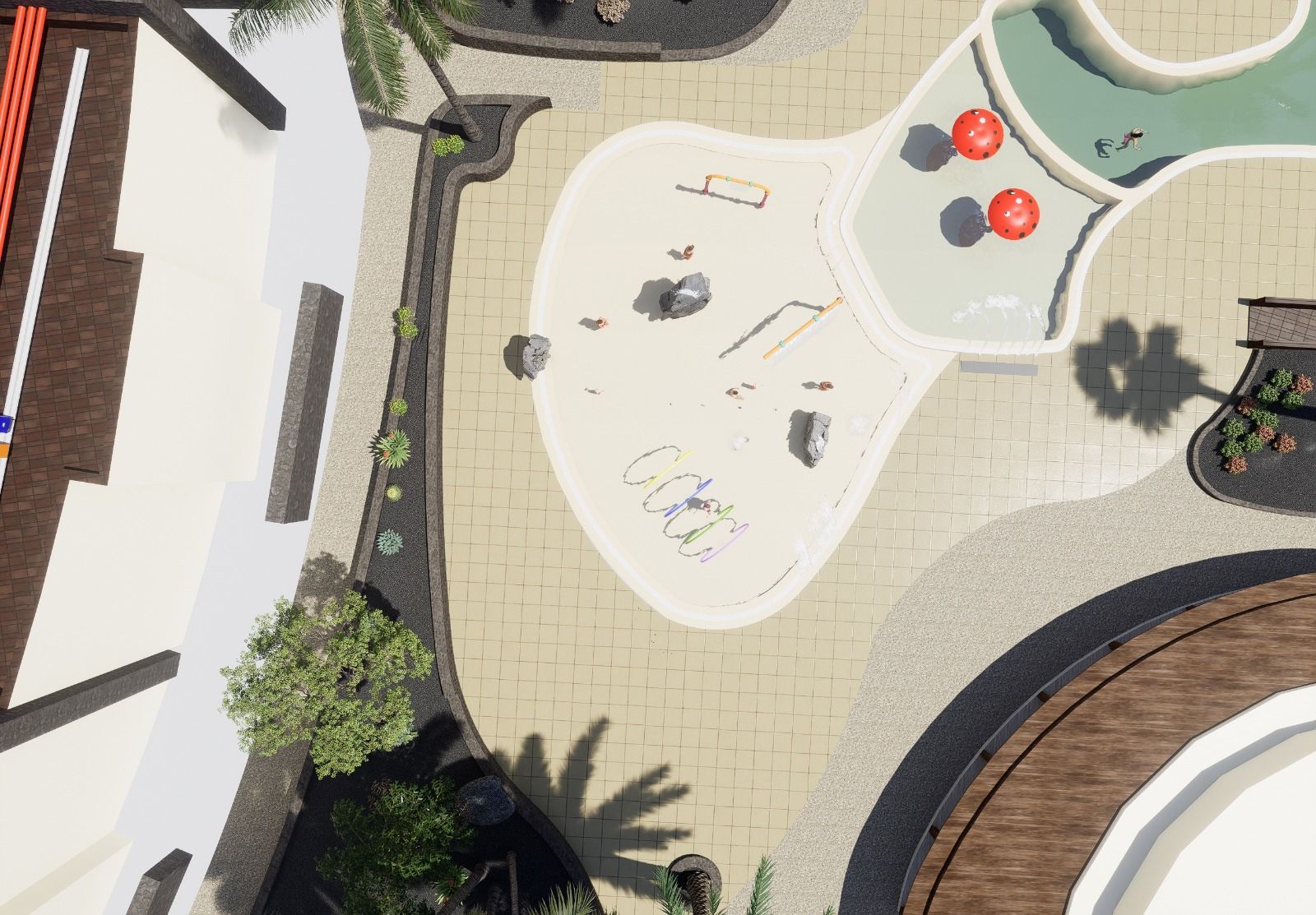 Vista aérea de un parque infantil de colores claros con sombrillas rojas, rodeado por un patio y edificios de colores claros.