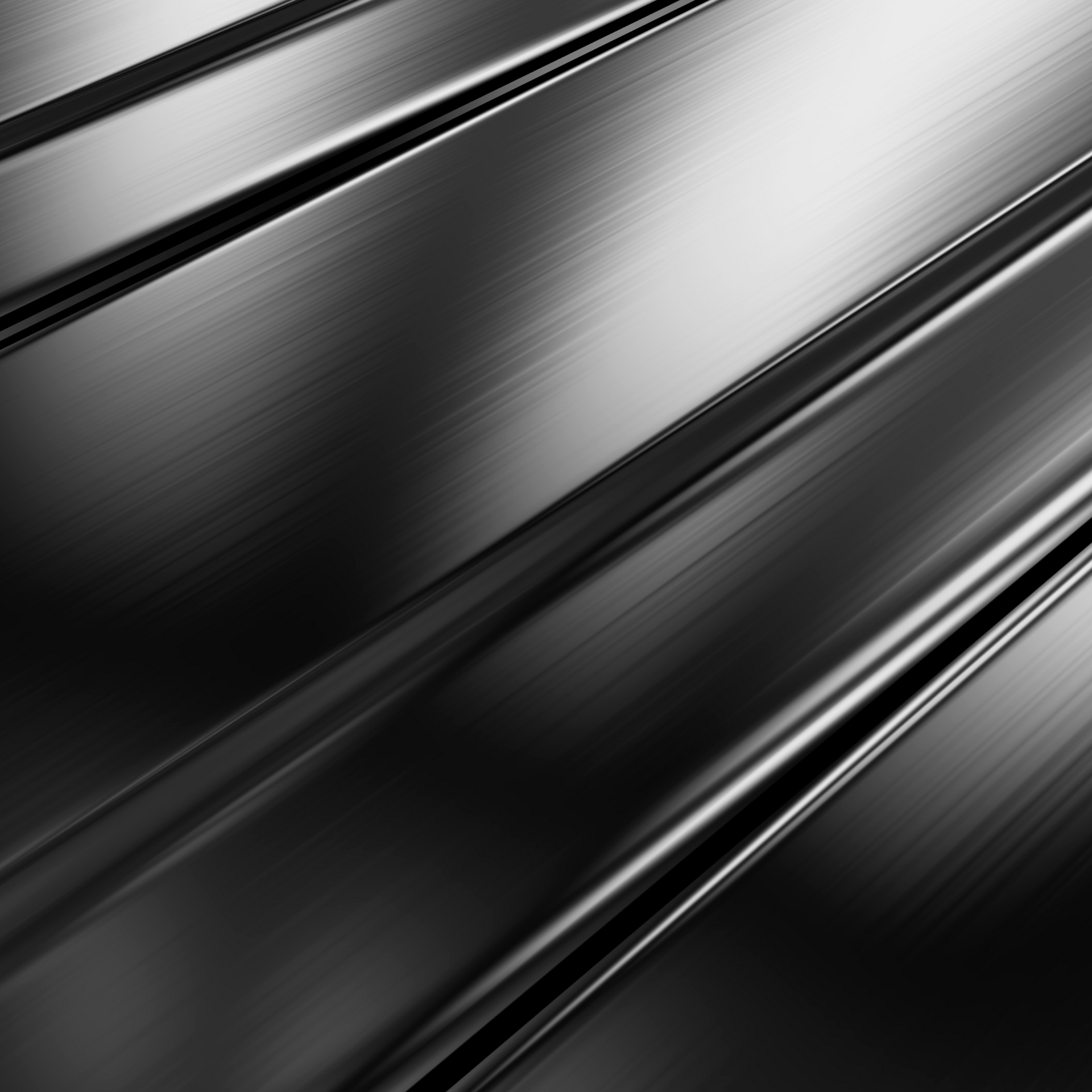 Un primer plano de una superficie de metal negro con textura de acero inoxidable.