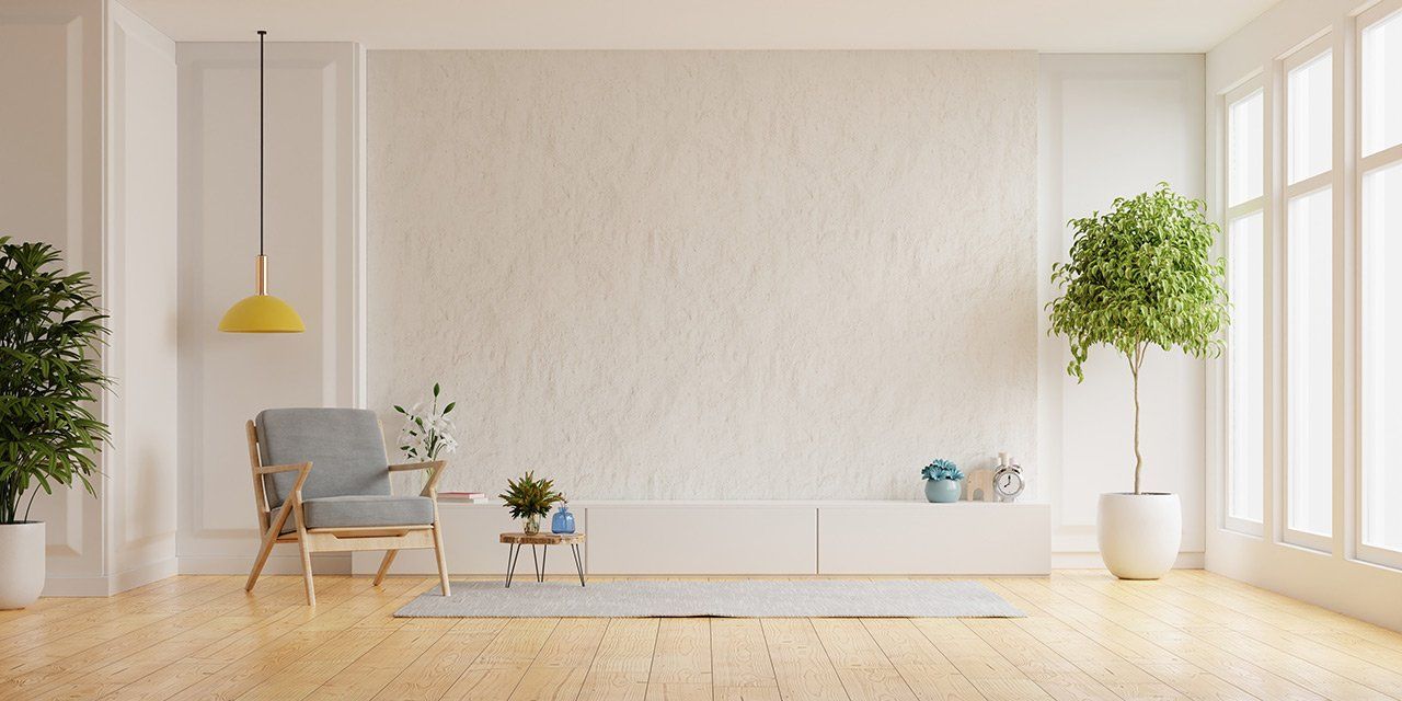 Mur blanc en enduit dans salon minimaliste.