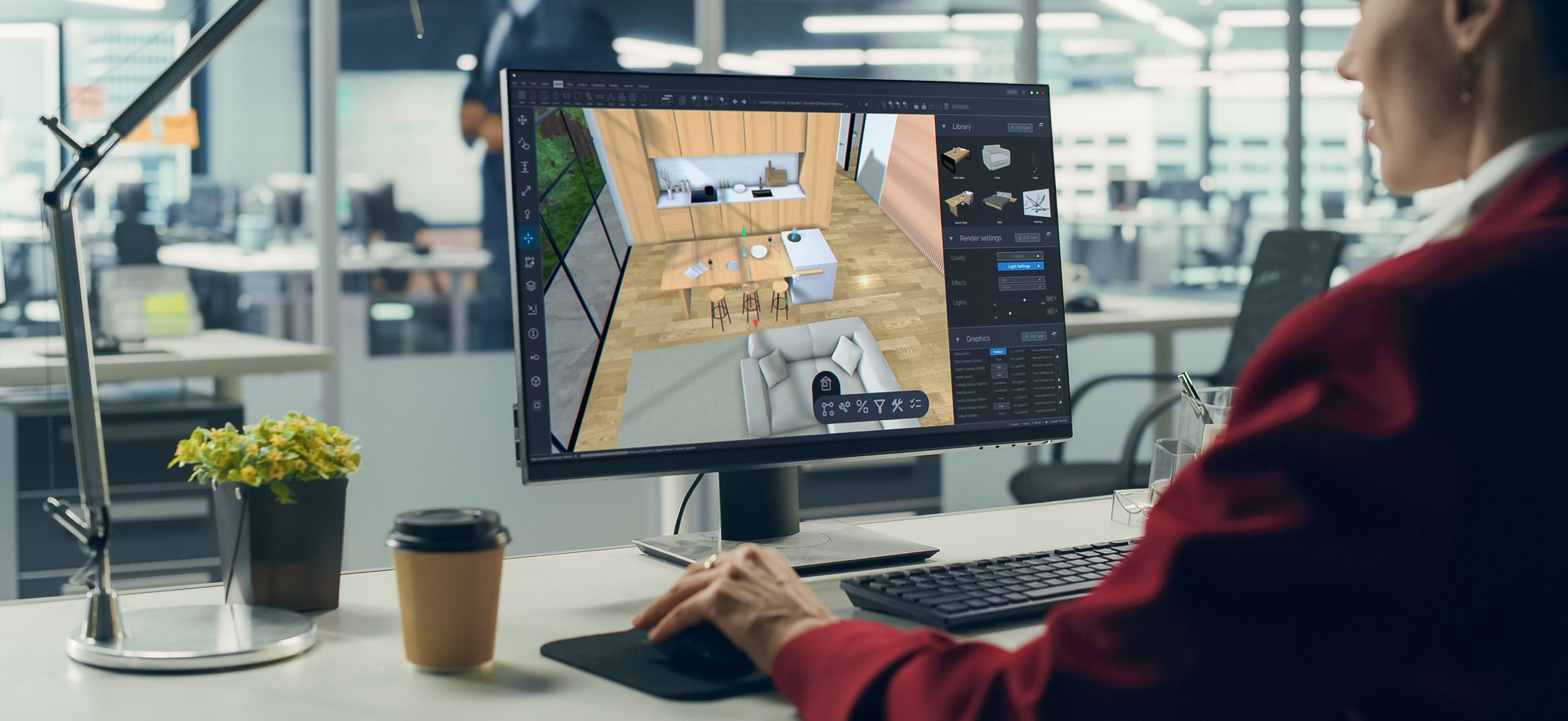Une personne travaillant à un bureau avec un grand écran affichant une interface de conception ou de jeu