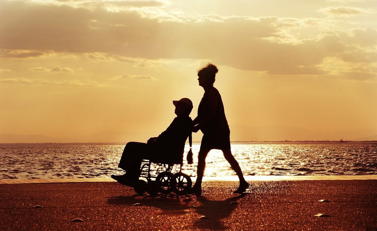 Wheelchair user on an accessible holiday on the beach