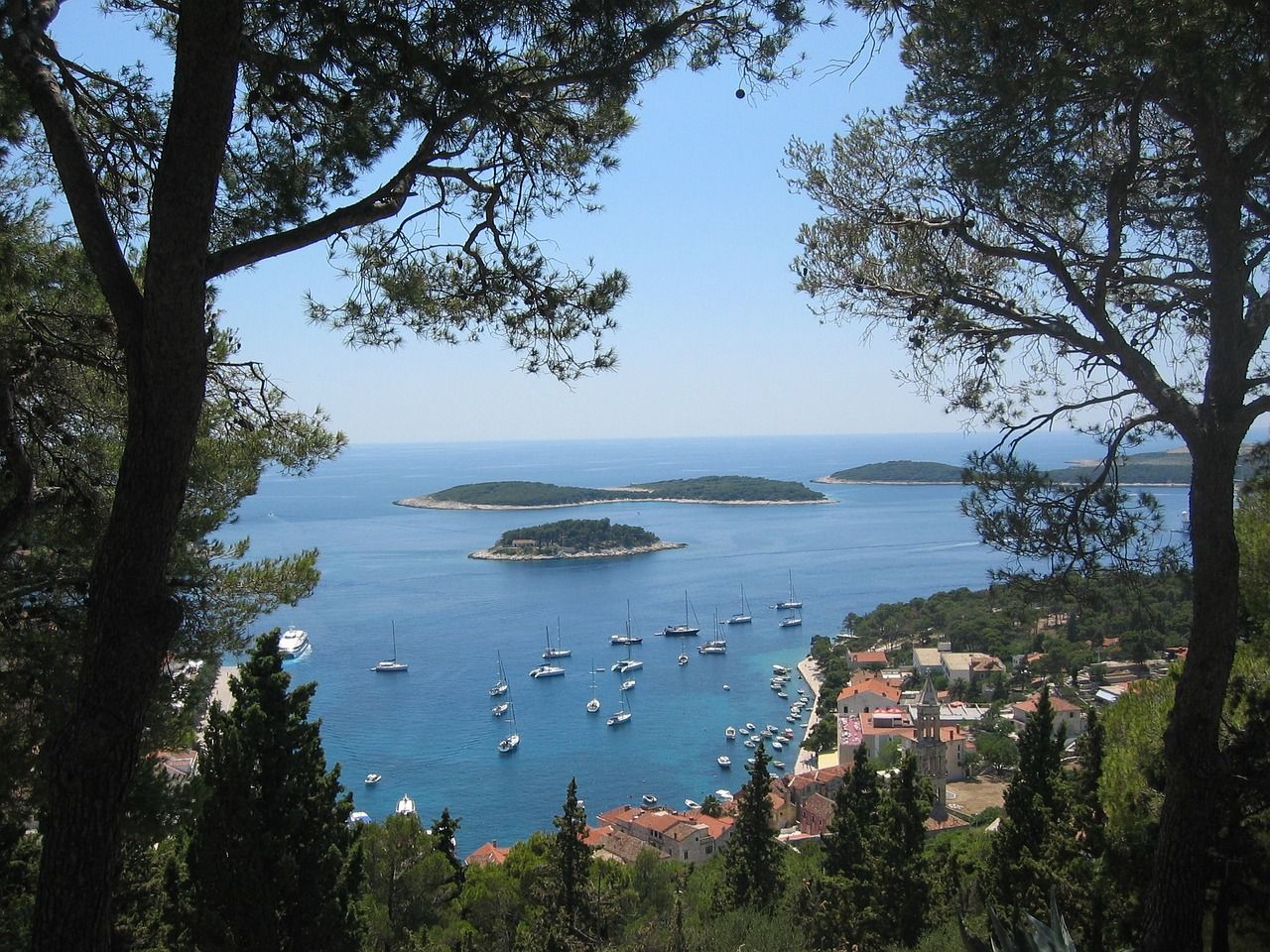 A view of a body of water surrounded by trees in Hvar, Croatia