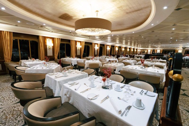 A large dining room filled with tables and chairs.