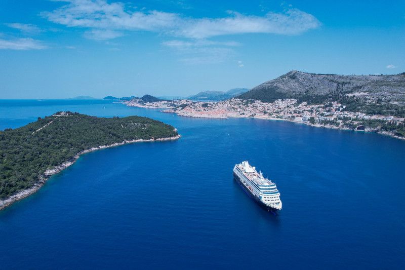 An aerial view of a cruise ship in the ocean.