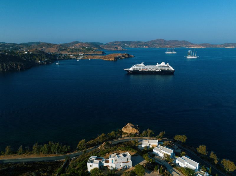 An aerial view of a cruise ship in the middle of the ocean with Azamara written on it