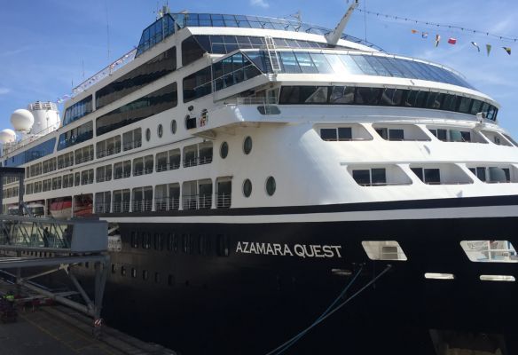a large cruise ship called azamara quest is docked in a harbor