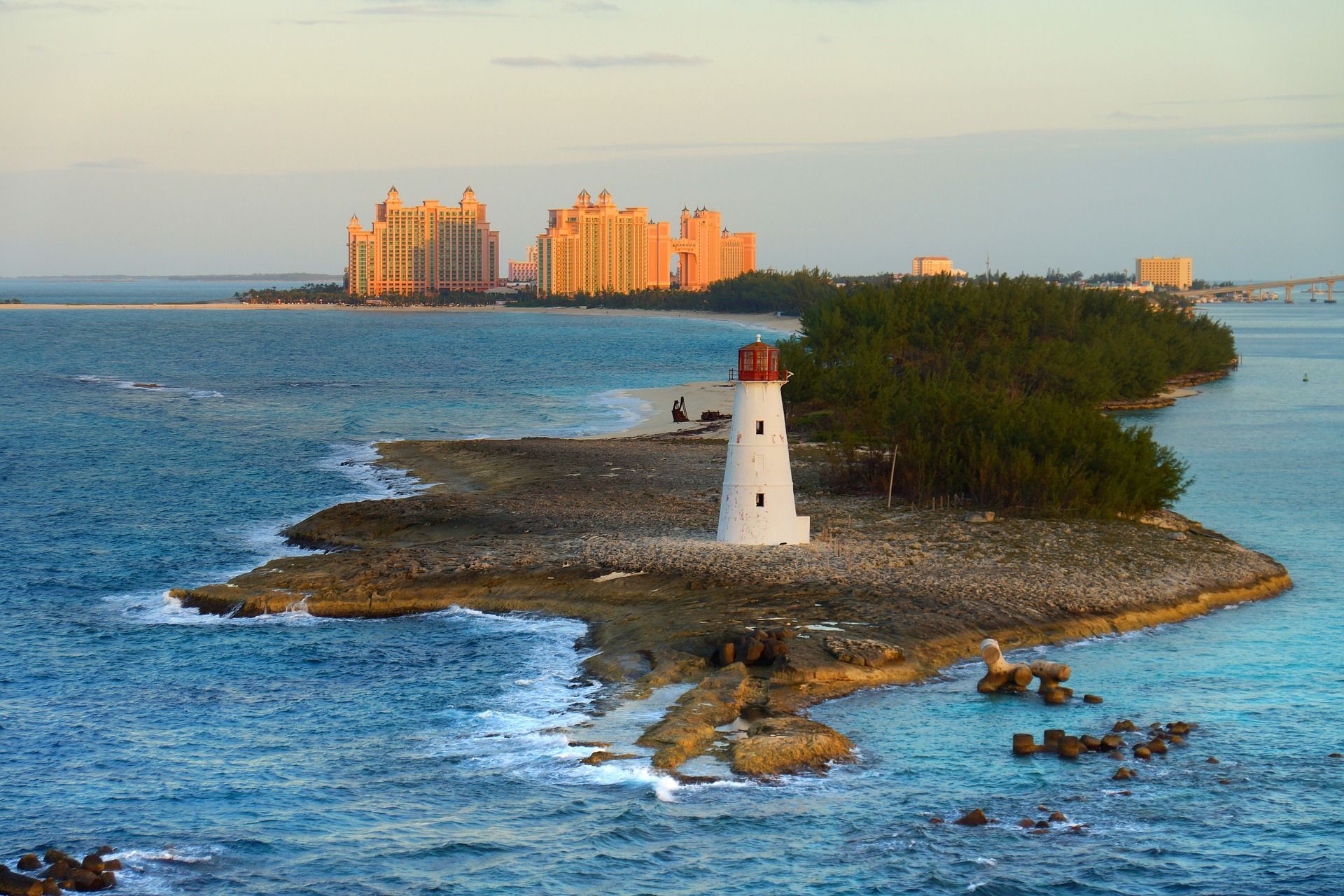 A lighthouse on a small island in the middle of the ocean in the Bahamas