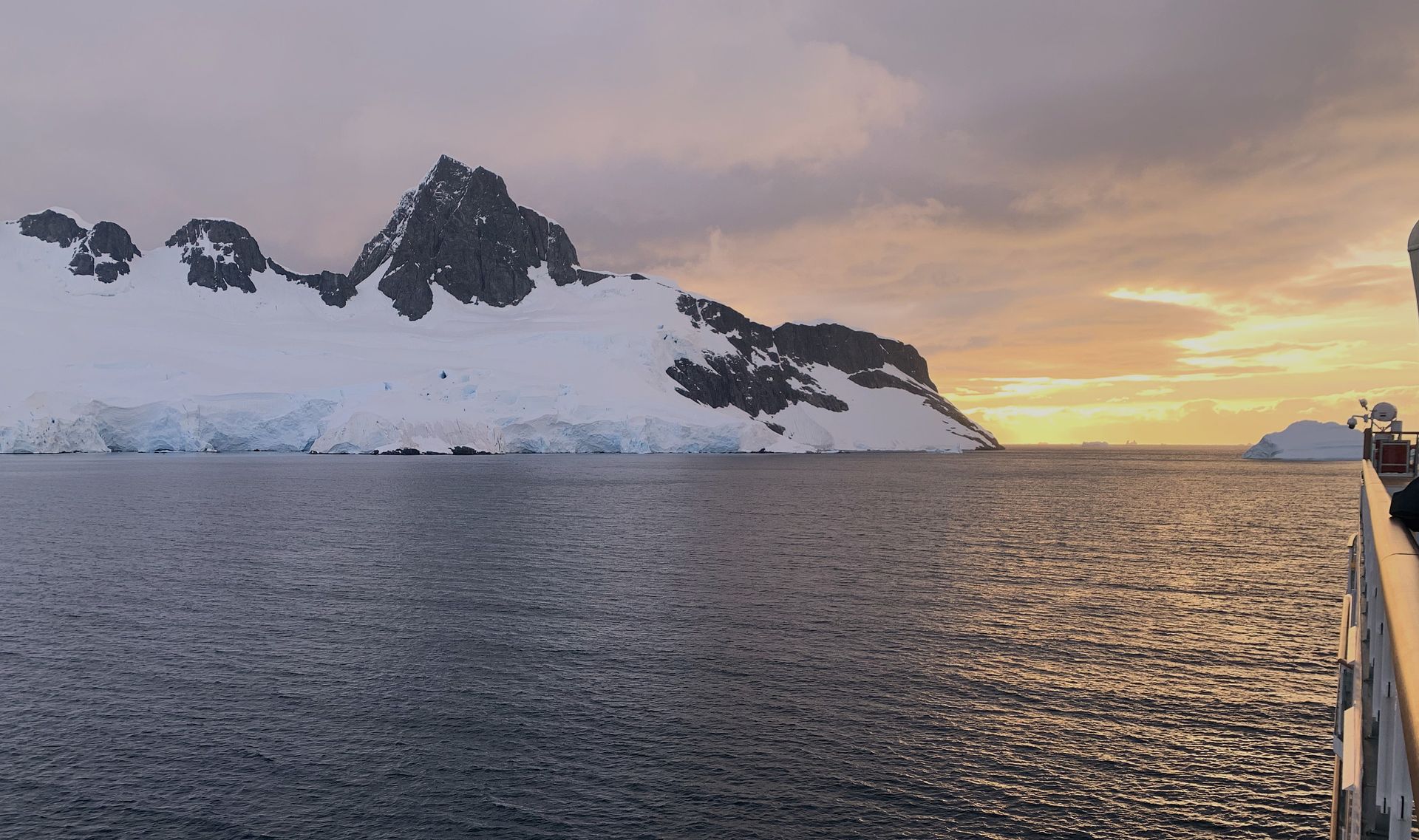 A large body of water with a mountain in the background