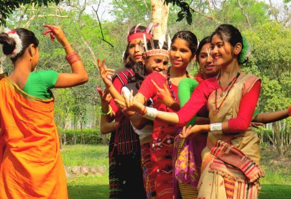 A group of women are dancing together in on a Brahmaputra River Cruise
