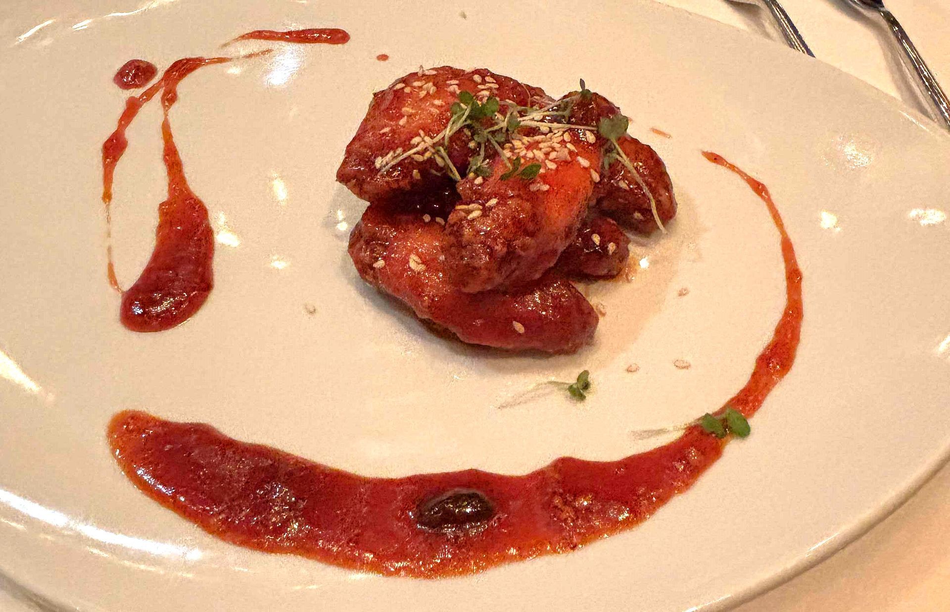 A close up of a plate of food with sauce on it