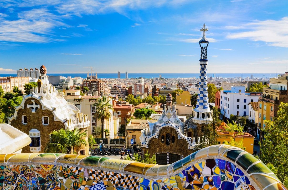 An aerial view of barcelona city with a tower in the middle of it.
