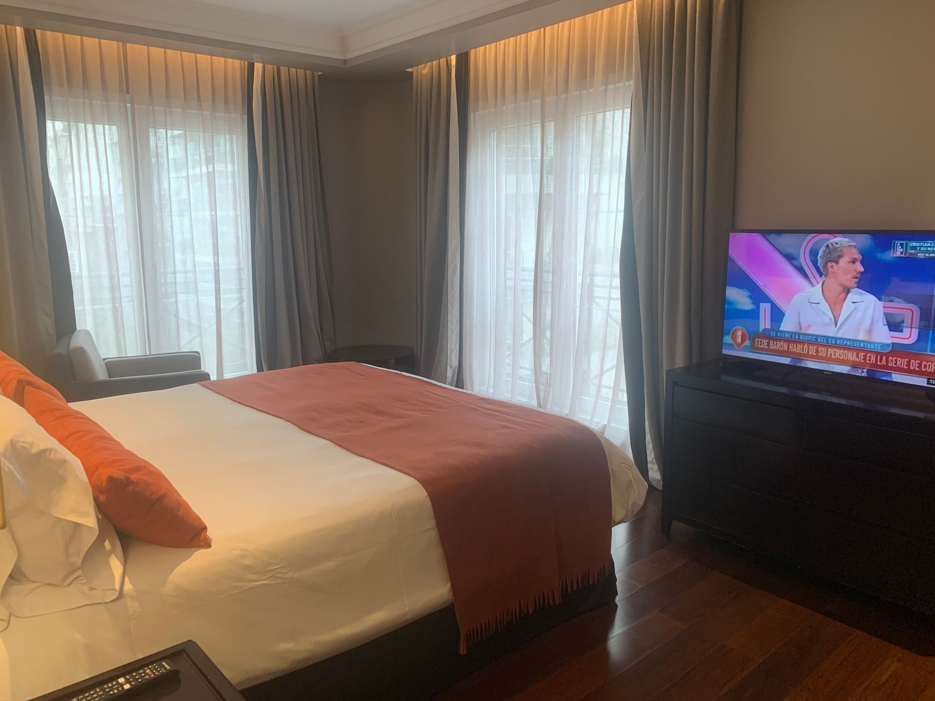 A hotel bedroom with a large bed and a flat screen tv.