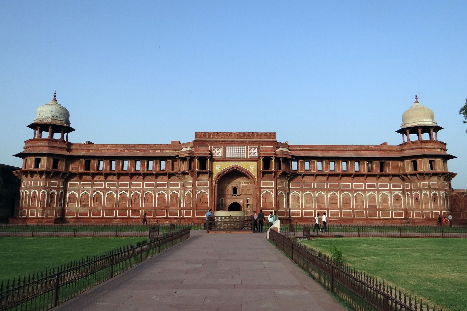 A large building with a fence in front of it