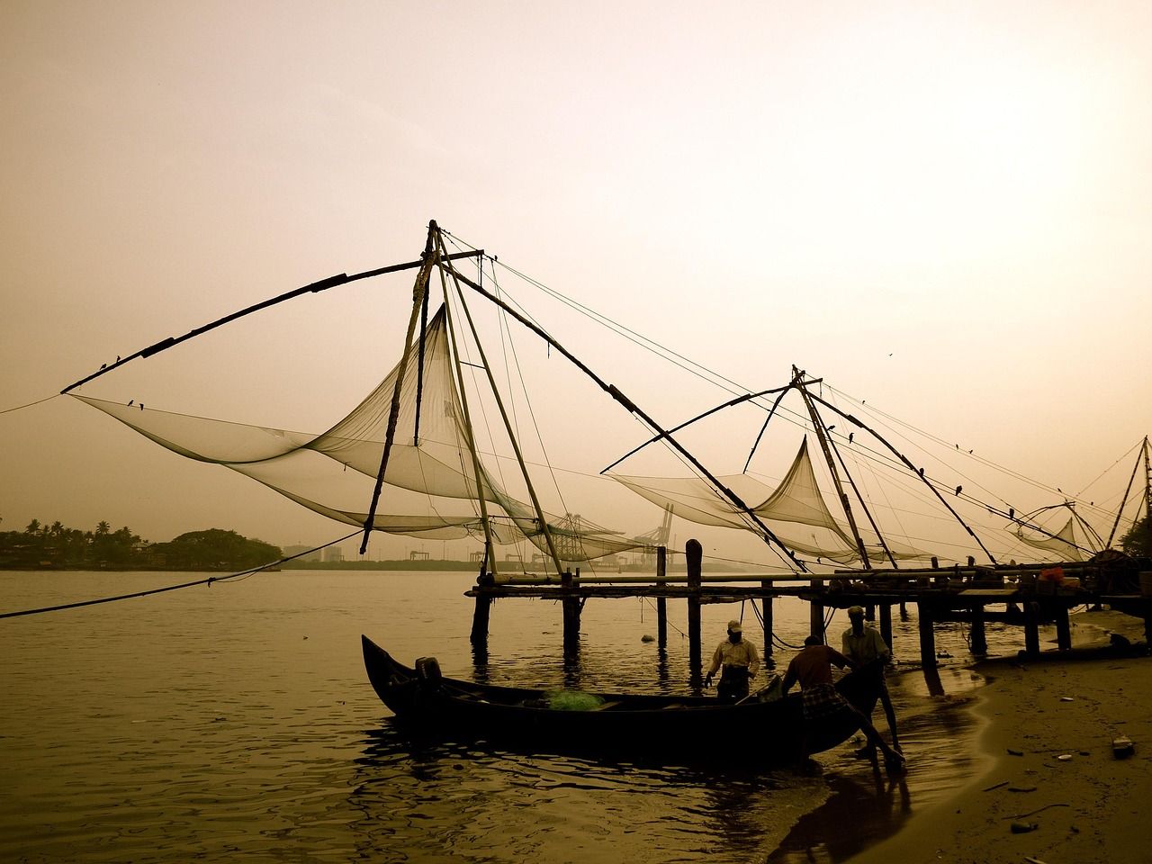 A boat is docked at a pier in the water