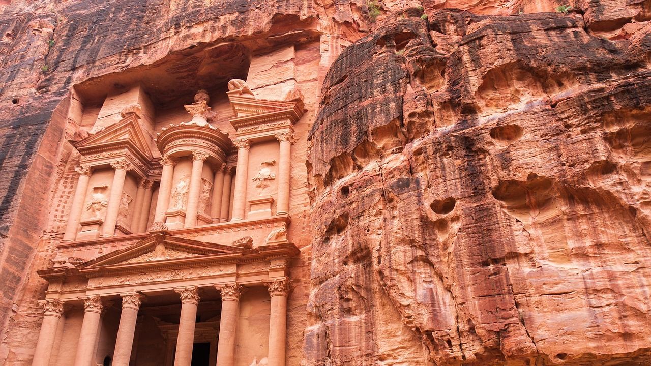 A very old building carved into the side of a mountain in petra on Crystal Cruises World Cruise 2028 petra