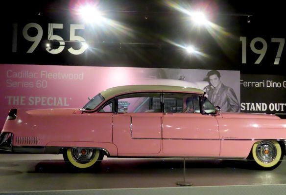 a pink cadillac fleetwood series 60 is on display Elvis’s Pink Cadillac at Graceland