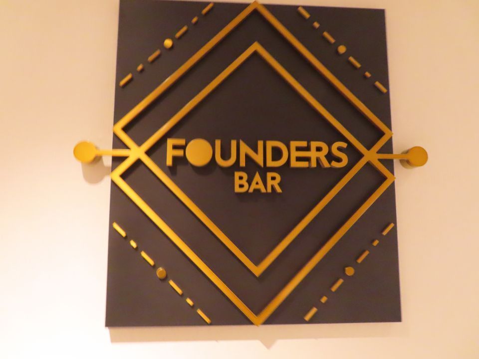 A sign that says founders bar on it