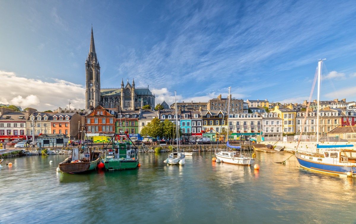 A harbor filled with boats and buildings on a sunny day.