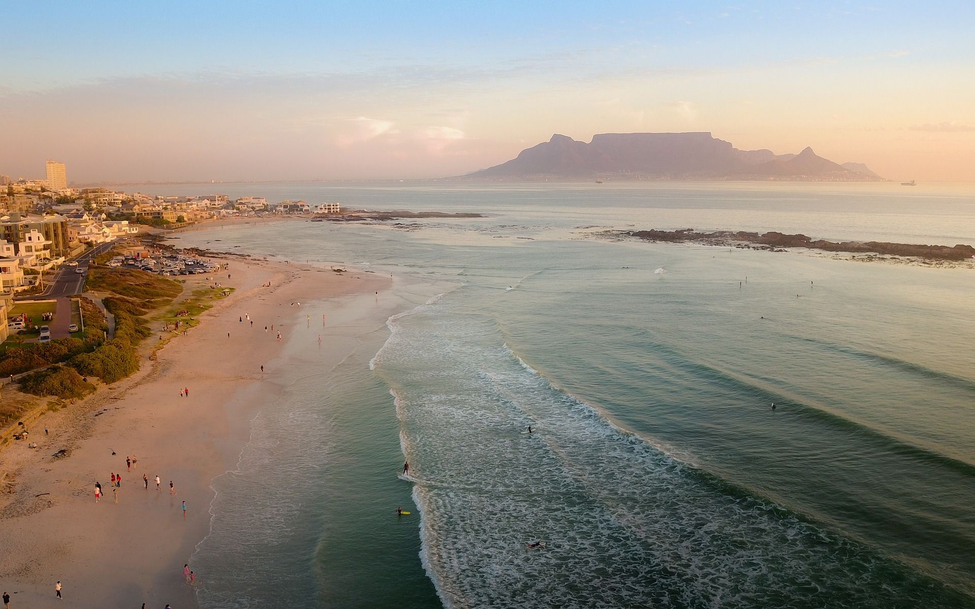 An aerial view of a beach with Table Mountain in the background near Cape Town on the Garden Route.