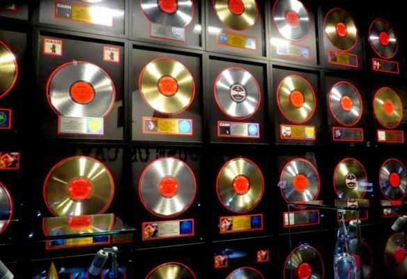 a wall filled with lots of gold and silver records - Gold & Silver Discs – Johnny Cash Museum