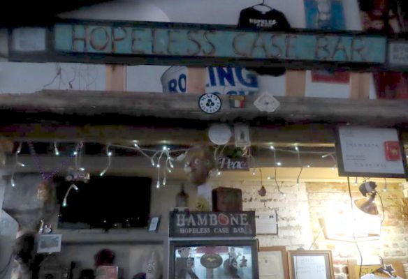 a bar with a sign that says `` hopeless case bar '' on it seen at Hopeless Case Bar, Hambone Art & Music shop, Clarksdale Mississippi