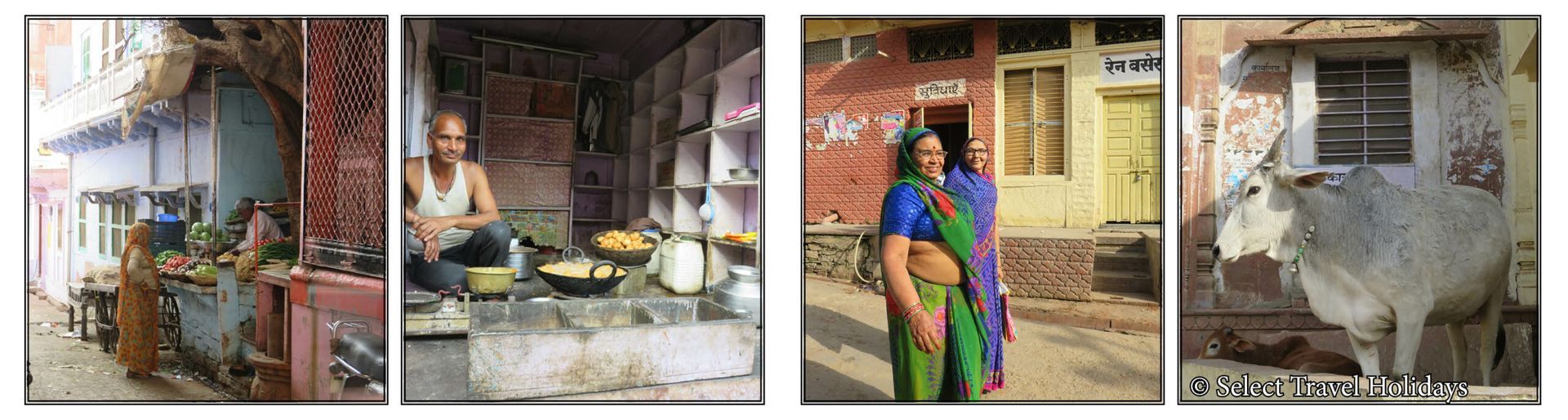 A woman in a green sari is standing in front of a building.