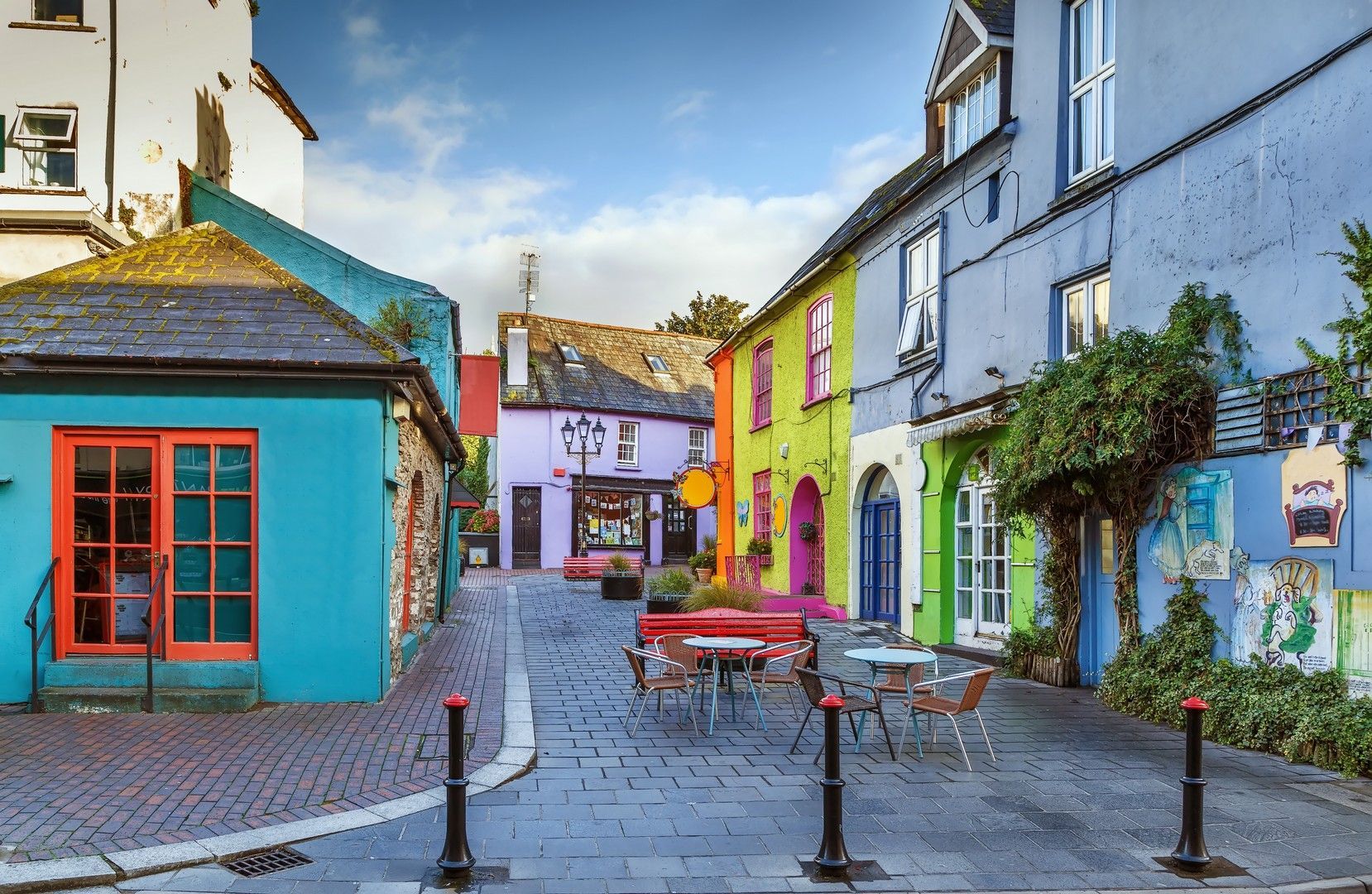 A narrow street with a lot of colorful buildings