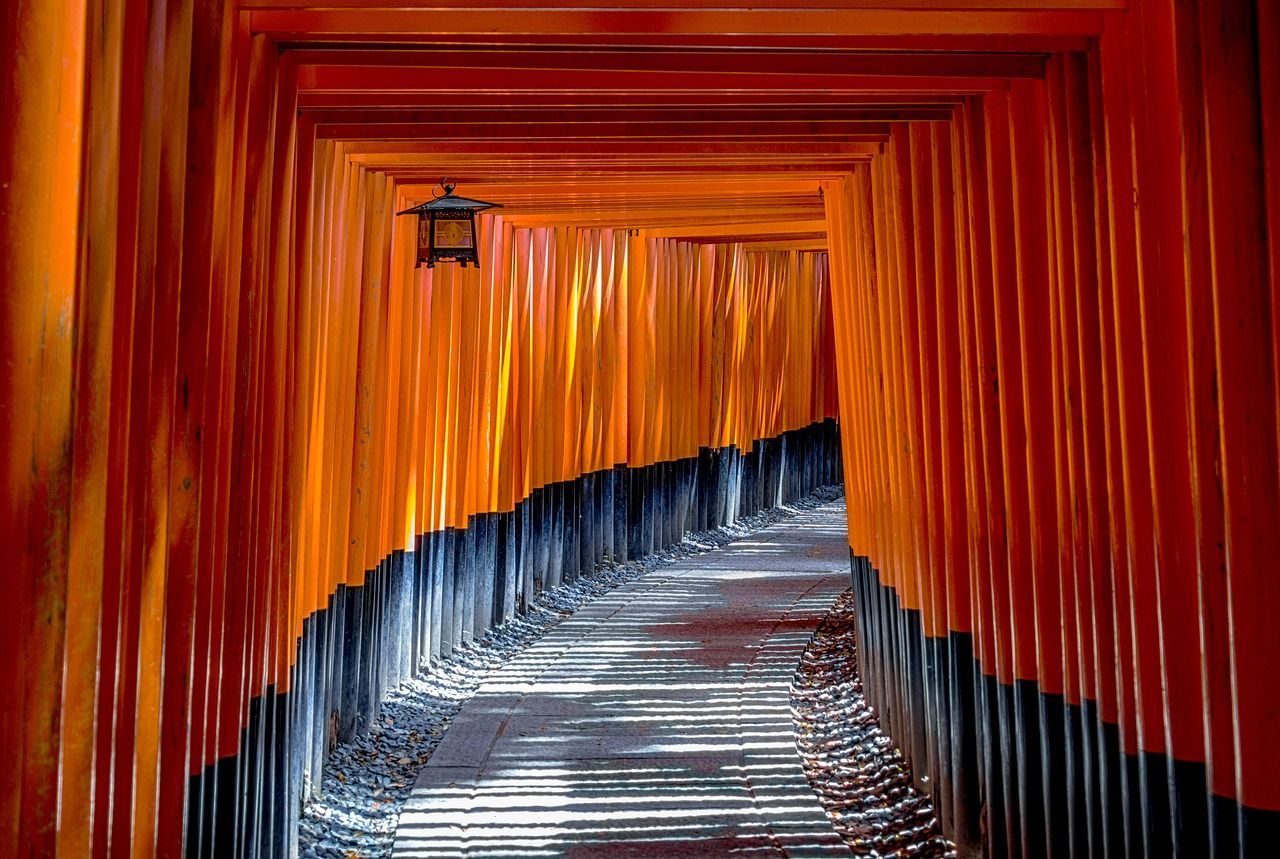 A painting of a tunnel with a lantern hanging from the ceiling.