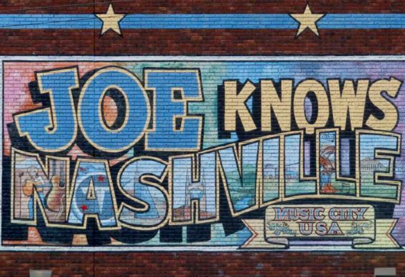 a mural on a brick wall says joe knows nashville .