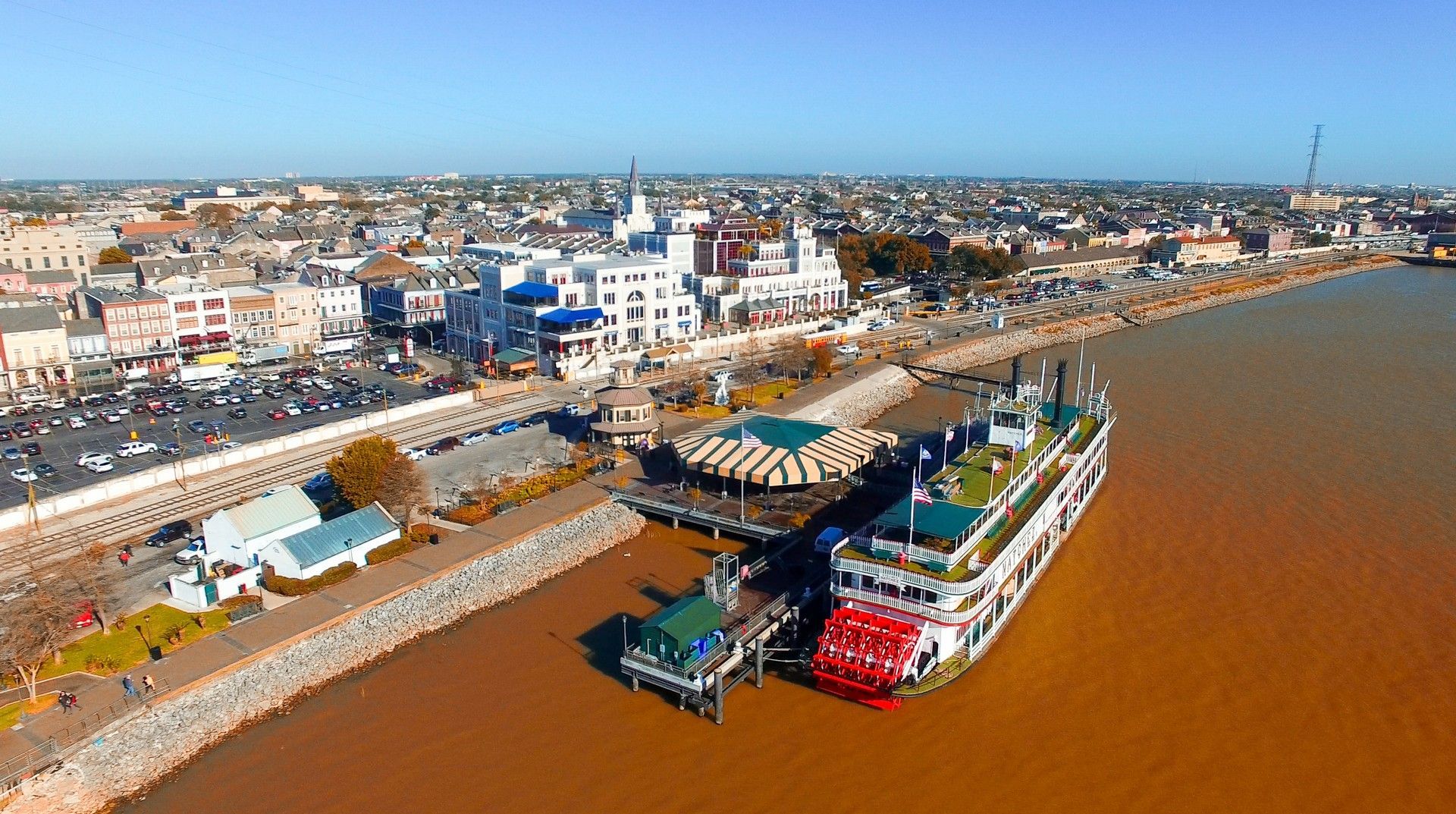 An aerial view of a large body of water with a city in the background.