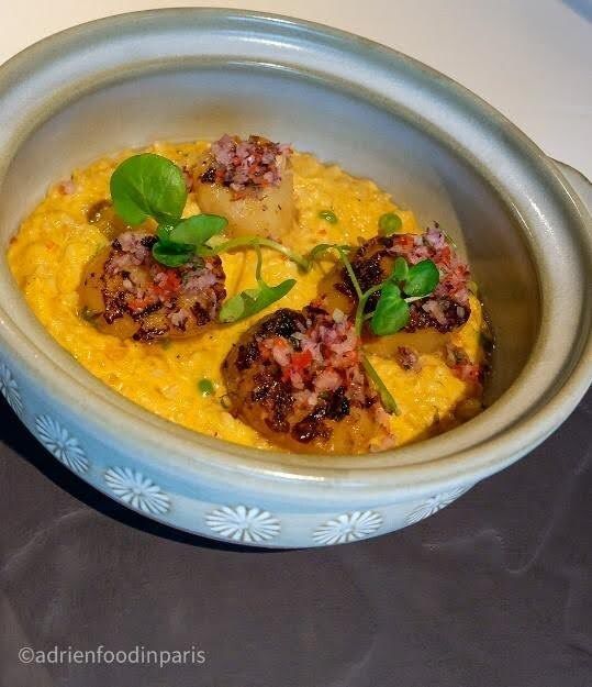 A bowl of food Cazuela de Arroz Nikkei Cuisine at Red Ginger on oceania cruises