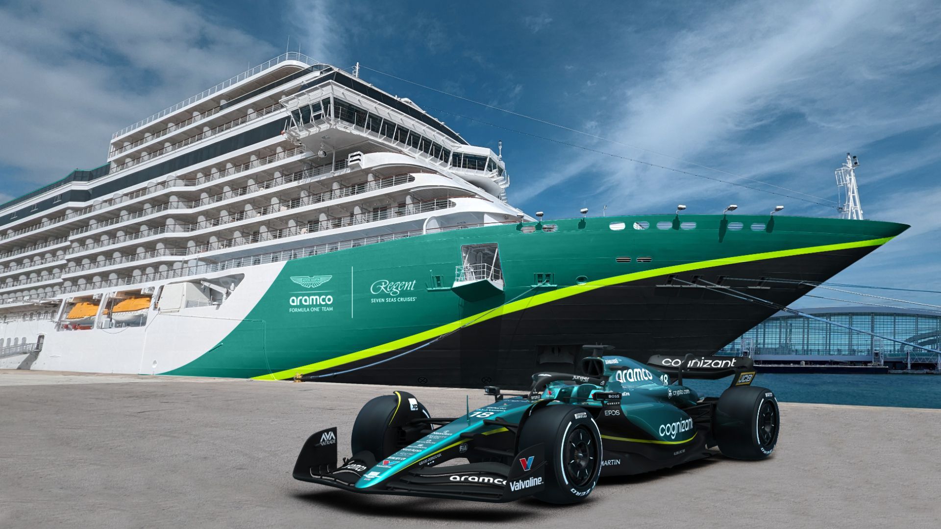 a race car is parked in front of a large cruise ship Regent Seven Seas Cruises and Aston Martin Aramco Formula One