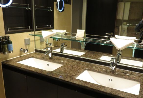 a bathroom with two sinks and a mirror in the Royal Suite on Avalon Envision