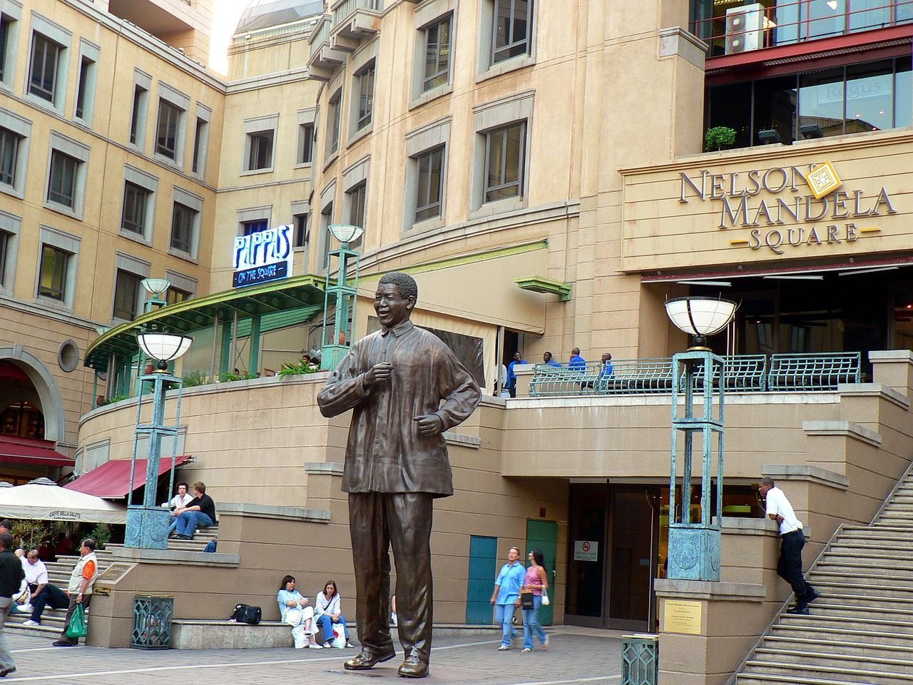 A statue of nelson mandela is in front of a building in johannesburg