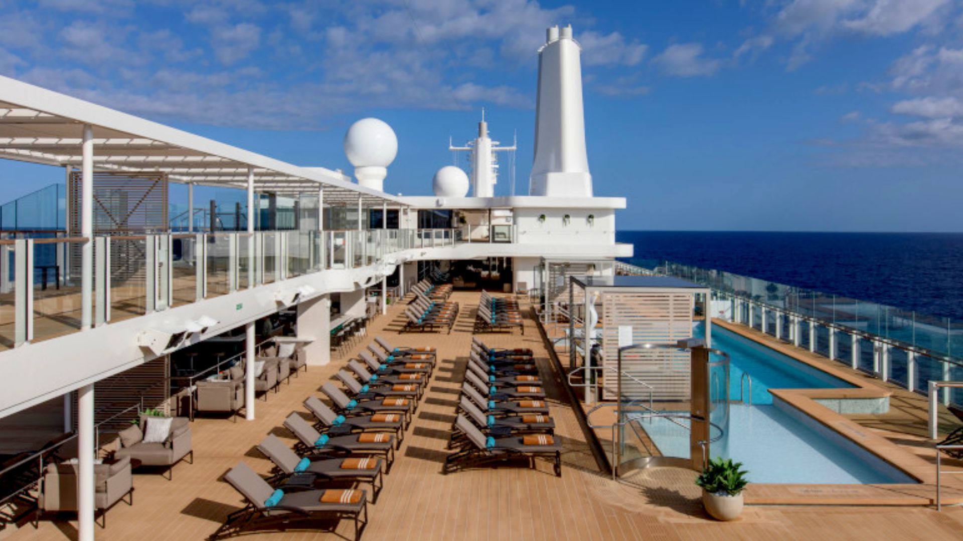 there is a large swimming pool on the deck of a cruise ship, Silver Nova