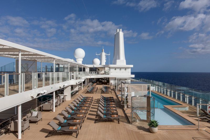 There is a large swimming pool on the deck of a cruise ship on Silver Nova cruise ship