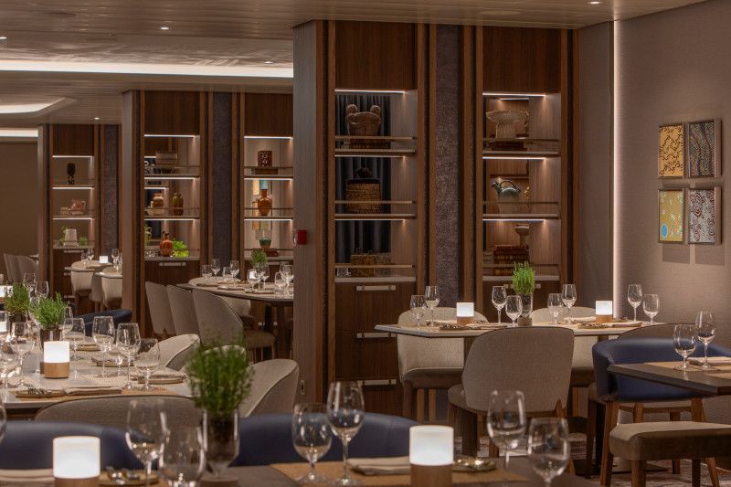A restaurant filled with tables and chairs and glasses of wine on Silver Nova cruise ship