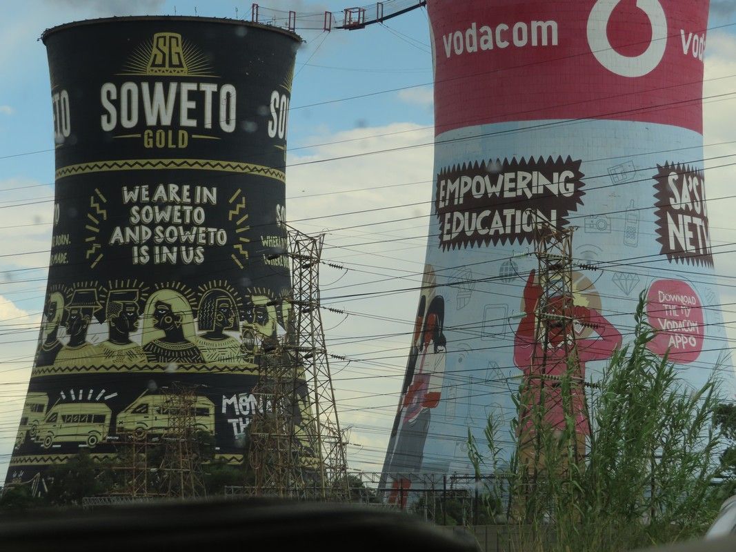 A vodacom tower is next to a soweto gold tower