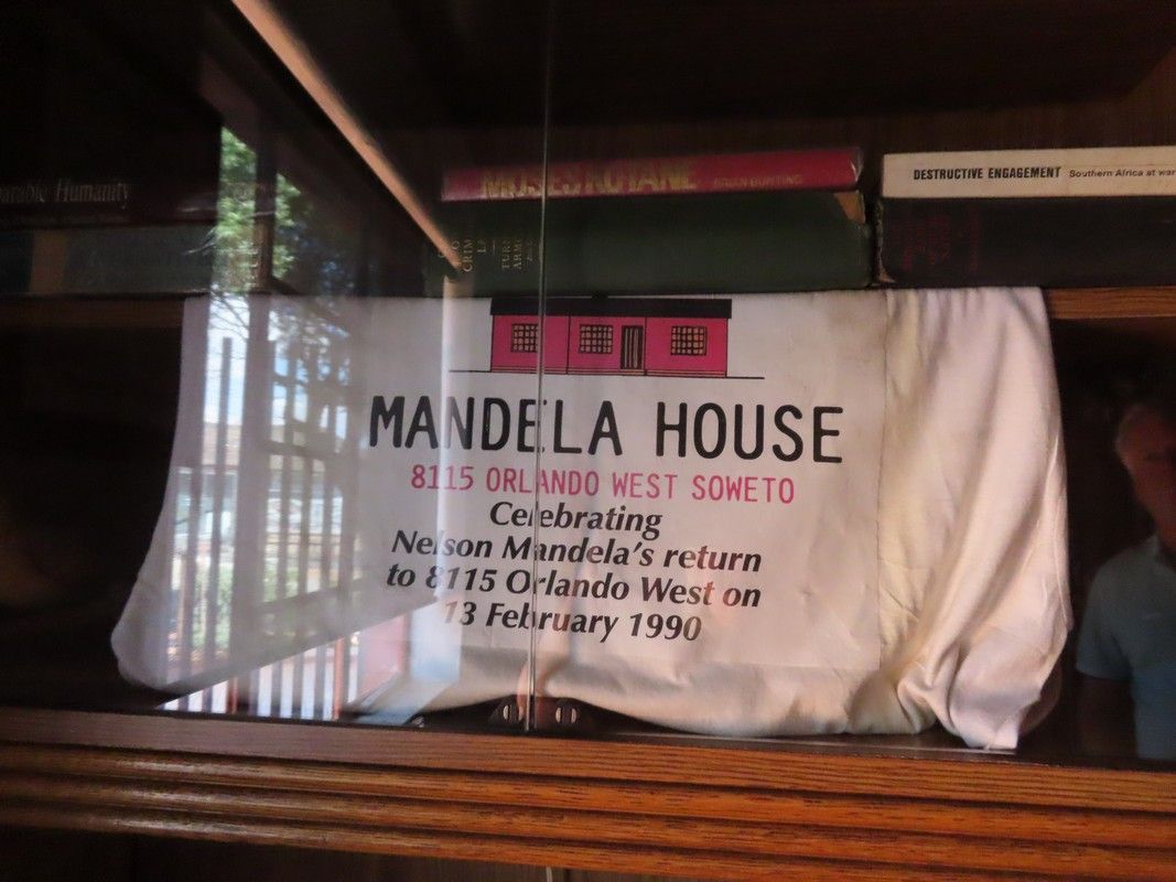 A sign that says mandela house on it